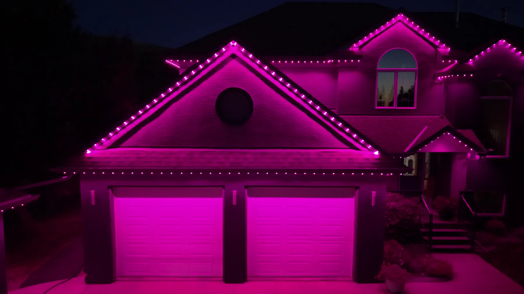 The same house lit in pink